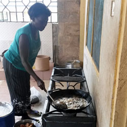 Women cooking on LPG stove in Ghana